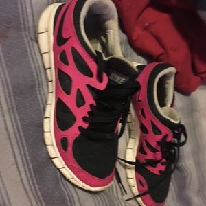 Pink and black nike sneakers